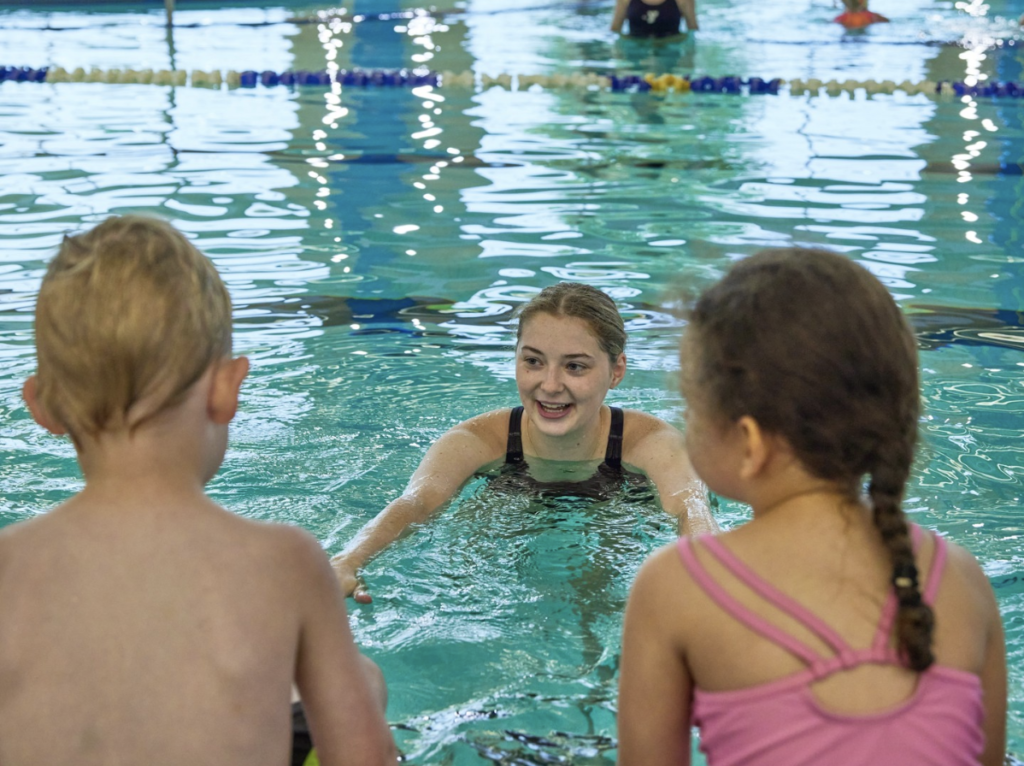 Children learning swim techniques with Southern Tier Aquatics