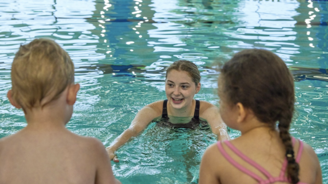 Children learning swim techniques with Southern Tier Aquatics