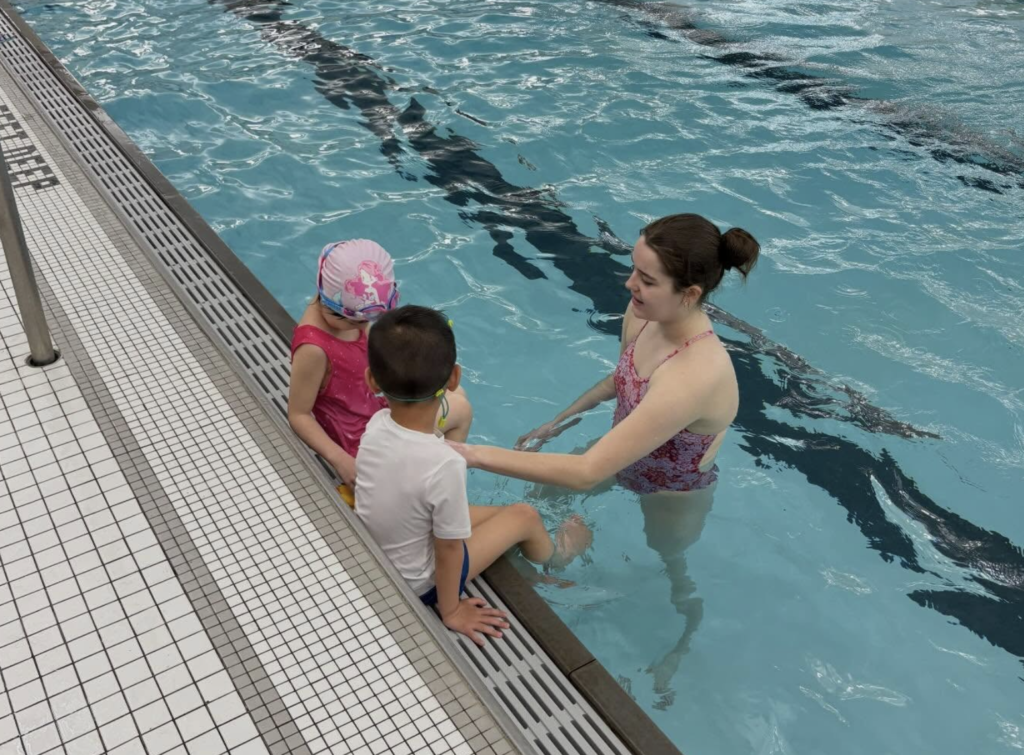 Children learning swim techniques with Southern Tier Aquatics